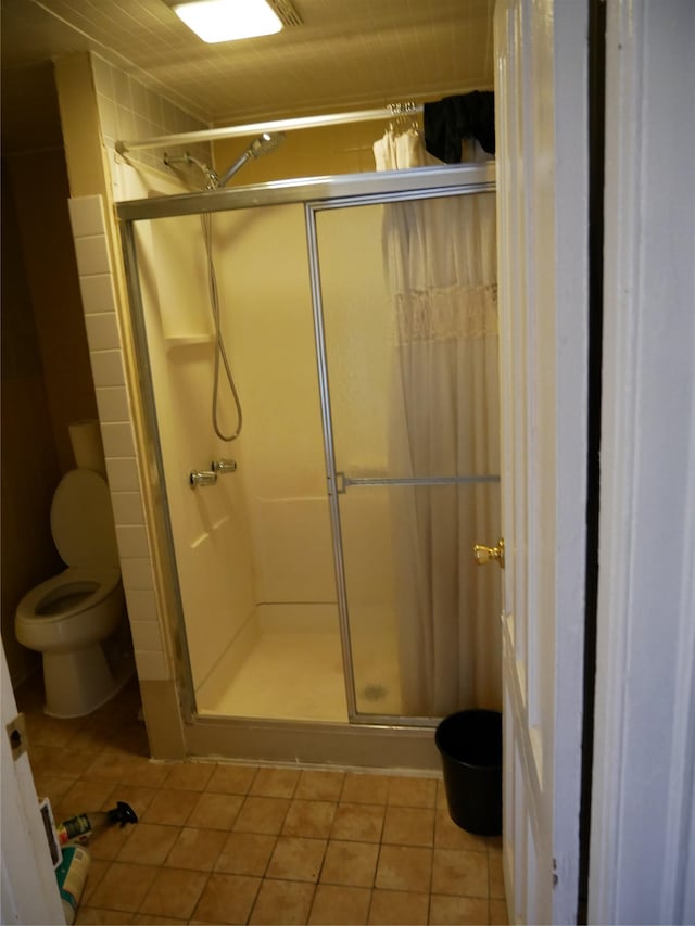 bathroom with tile walls