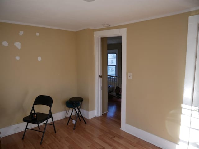 unfurnished room with crown molding and hardwood / wood-style floors