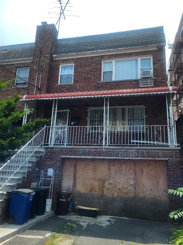 view of property featuring a porch