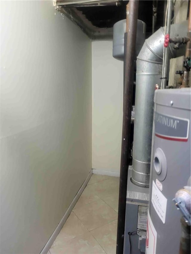 utility room featuring water heater