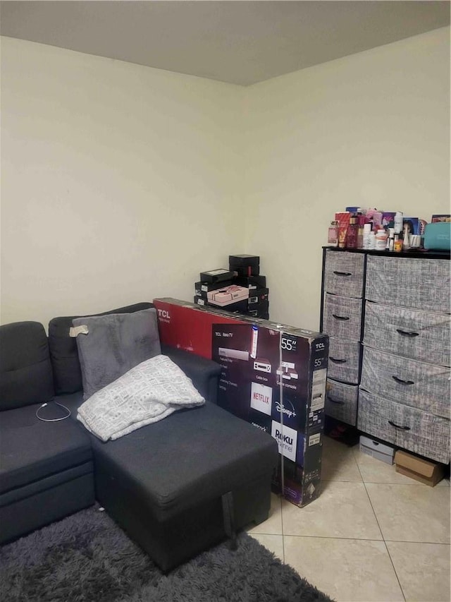 bedroom with light tile patterned floors