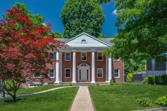 greek revival house with a front yard