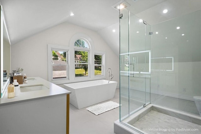 full bathroom with vanity, vaulted ceiling, tile patterned flooring, shower with separate bathtub, and toilet