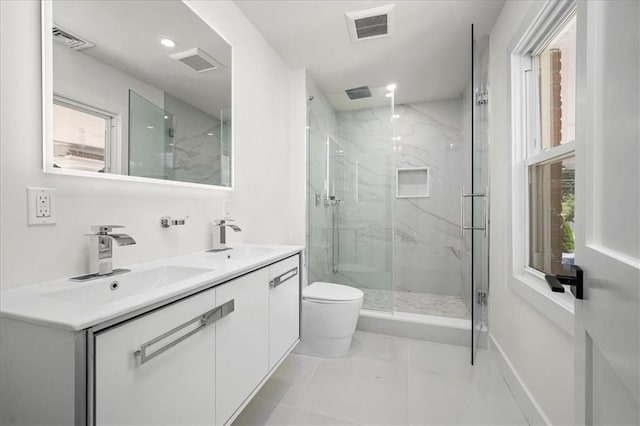 bathroom with vanity, toilet, and walk in shower