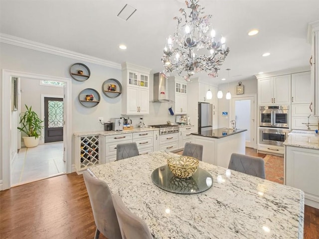 dining space featuring dark hardwood / wood-style flooring and ornamental molding