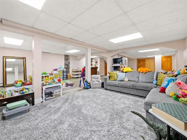 carpeted living room featuring a paneled ceiling