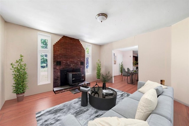 living room with a healthy amount of sunlight and light hardwood / wood-style floors