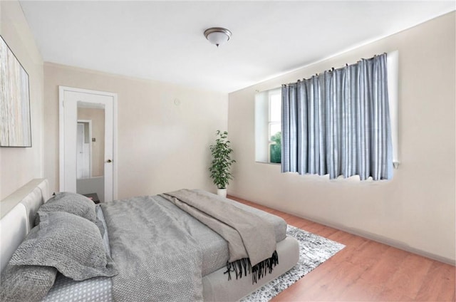 bedroom featuring hardwood / wood-style floors