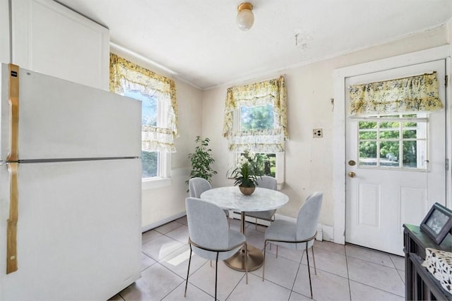 dining area with light tile patterned floors