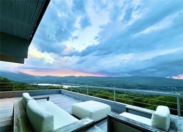 balcony at dusk with a mountain view