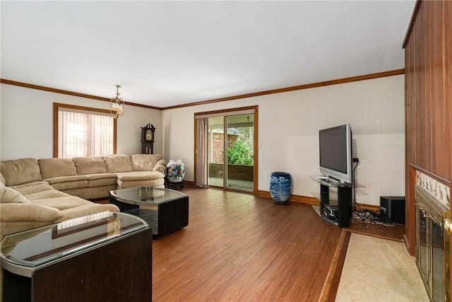 living room featuring crown molding and light wood-type flooring