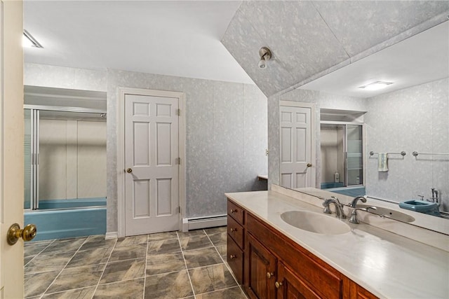 bathroom featuring shower / bath combination with glass door, vanity, and baseboard heating