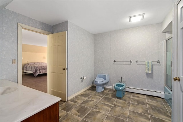 full bathroom with combined bath / shower with glass door, vanity, baseboard heating, a bidet, and toilet