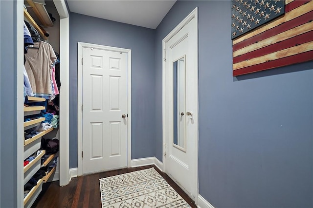 entryway with dark wood-type flooring