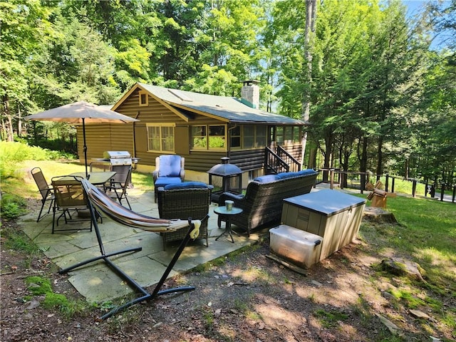 view of patio / terrace featuring grilling area and a sunroom