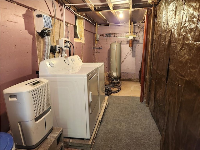 clothes washing area featuring washer and clothes dryer