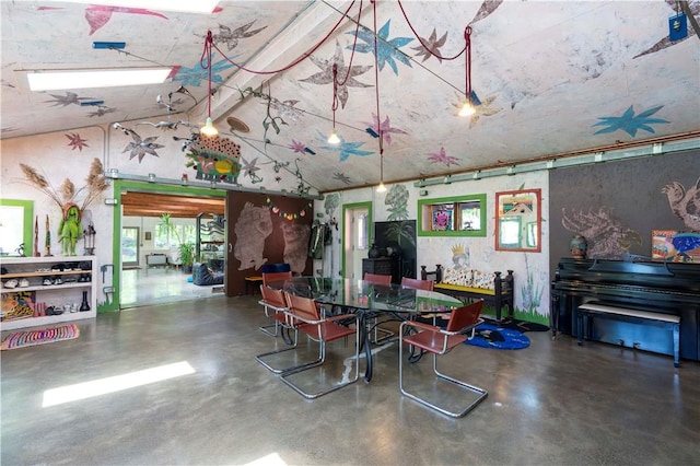 dining room with concrete flooring