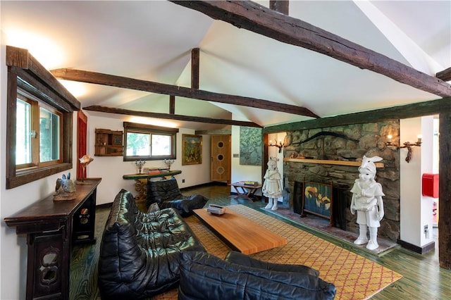 living room featuring dark hardwood / wood-style flooring, vaulted ceiling with beams, and a stone fireplace