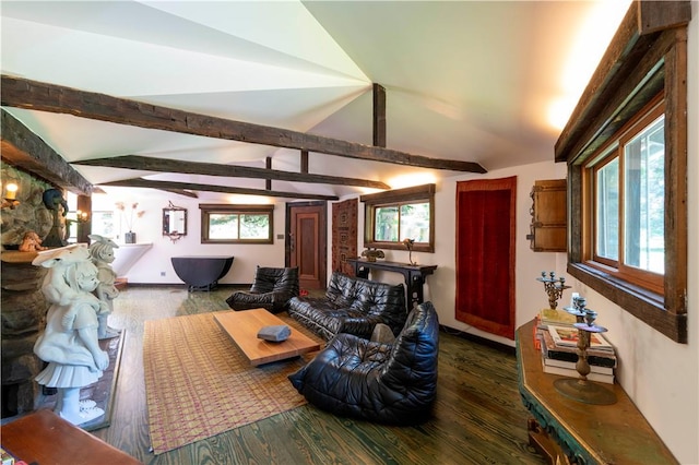 living room featuring dark hardwood / wood-style flooring, vaulted ceiling with beams, and a wealth of natural light