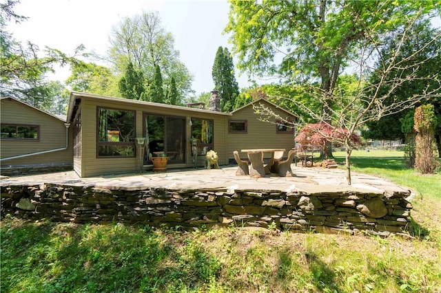 back of property with a patio area