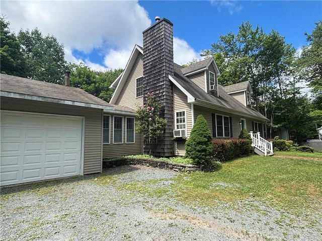 view of home's exterior with a garage and a yard