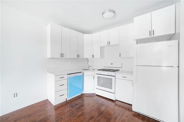 kitchen with white cabinetry, sink, dark hardwood / wood-style floors, and white appliances