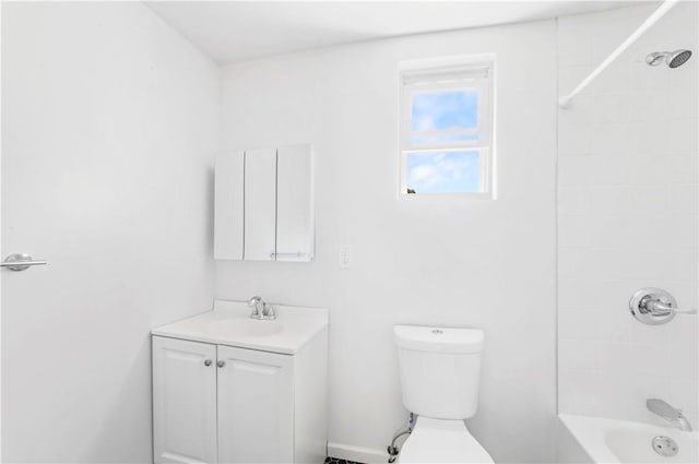 full bathroom featuring vanity, toilet, and tiled shower / bath