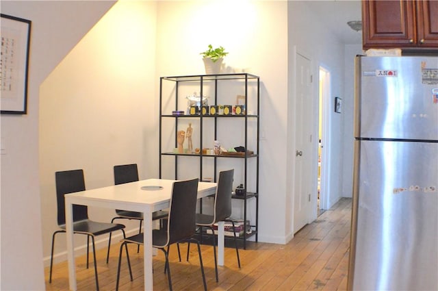 dining area with light hardwood / wood-style flooring