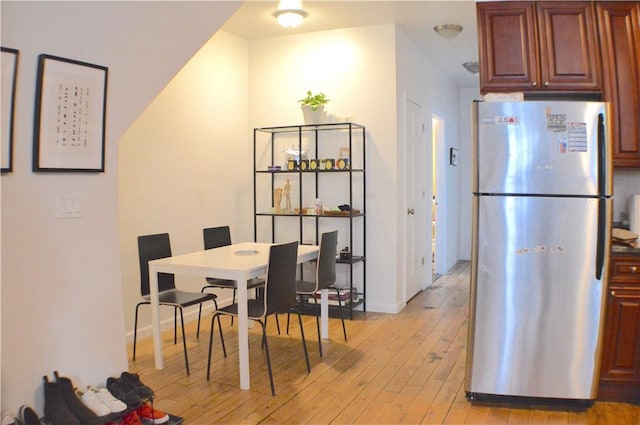 dining area with light wood-type flooring