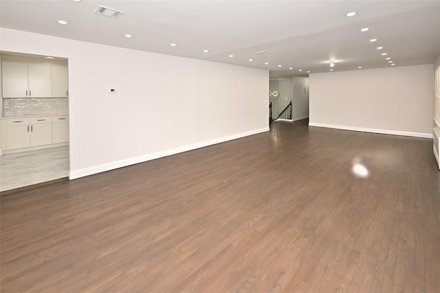 unfurnished room featuring dark hardwood / wood-style flooring