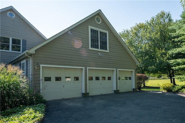 view of property exterior featuring a garage