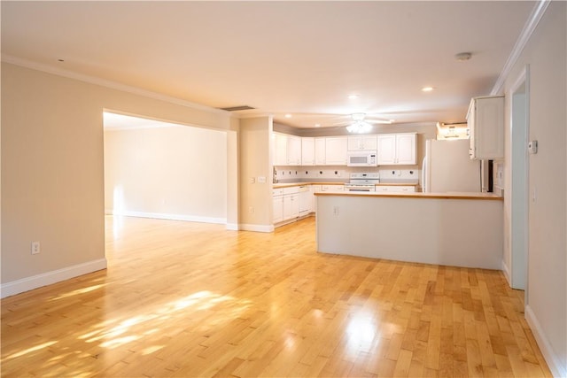 kitchen with white cabinetry, white appliances, crown molding, and light hardwood / wood-style flooring