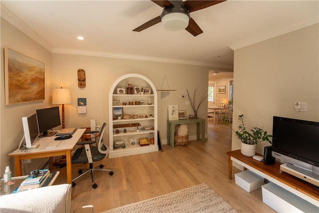 home office featuring crown molding and light hardwood / wood-style flooring