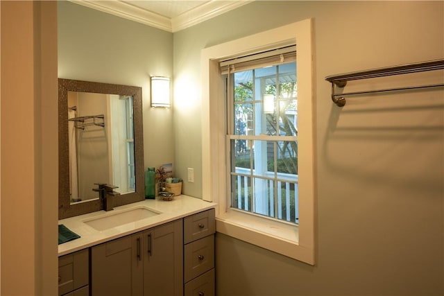 bathroom with vanity and ornamental molding