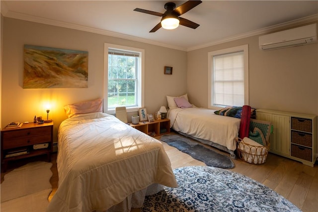 bedroom featuring a wall mounted AC, ceiling fan, light hardwood / wood-style floors, and ornamental molding