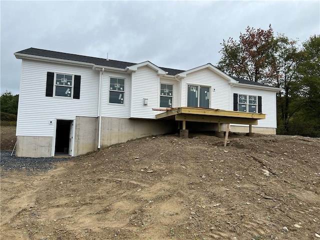 rear view of house with a deck