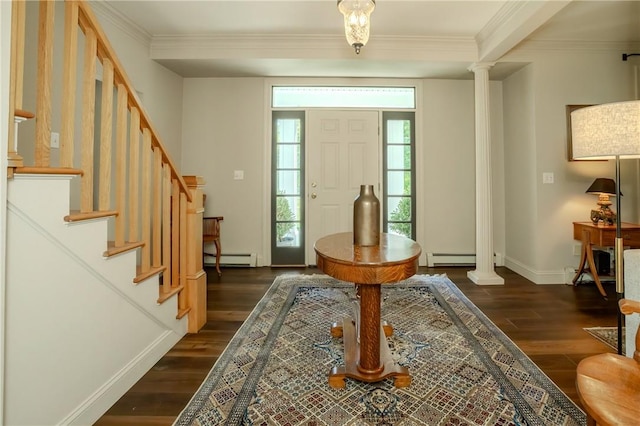 foyer with ornate columns, crown molding, dark wood-type flooring, and a baseboard heating unit