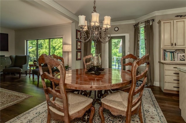 dining space featuring dark hardwood / wood-style floors, crown molding, and a chandelier