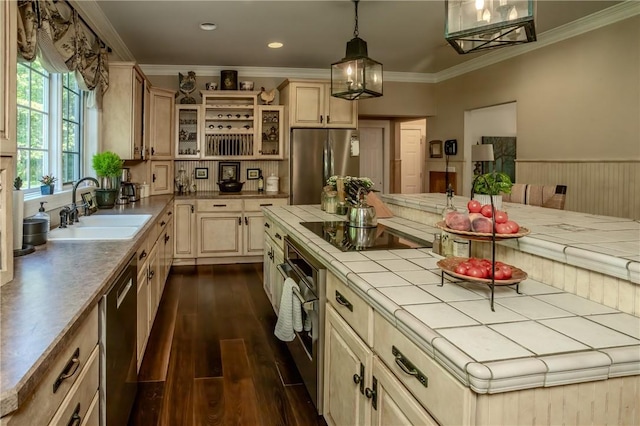 kitchen with stainless steel appliances, dark wood-type flooring, sink, tile countertops, and hanging light fixtures