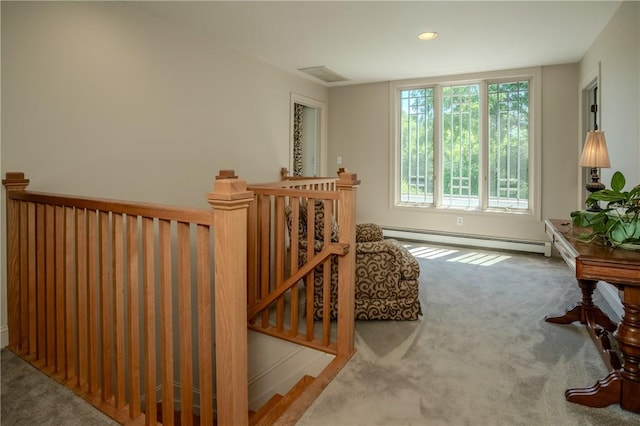 interior space featuring carpet flooring and a baseboard radiator