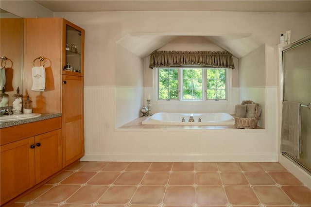 bathroom featuring shower with separate bathtub and vanity