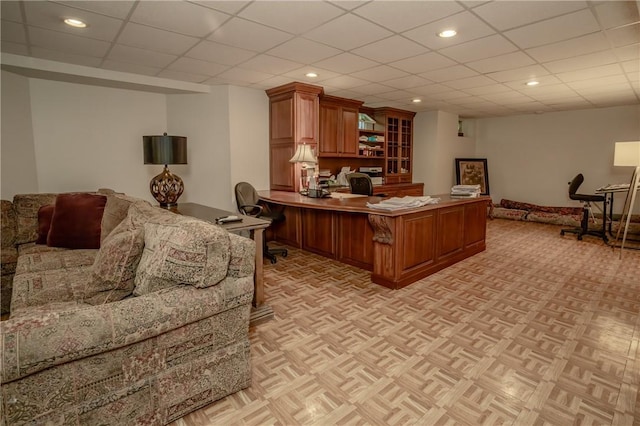 office featuring a drop ceiling and light parquet flooring