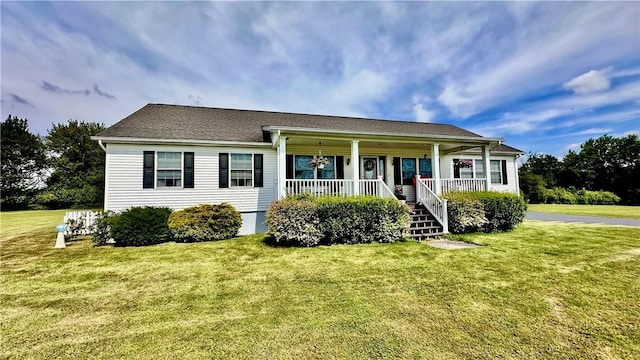 view of front of house featuring covered porch and a front yard