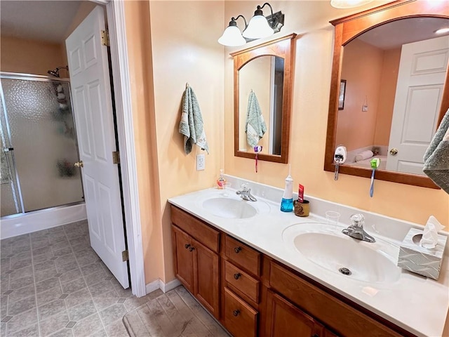 bathroom featuring vanity and an enclosed shower