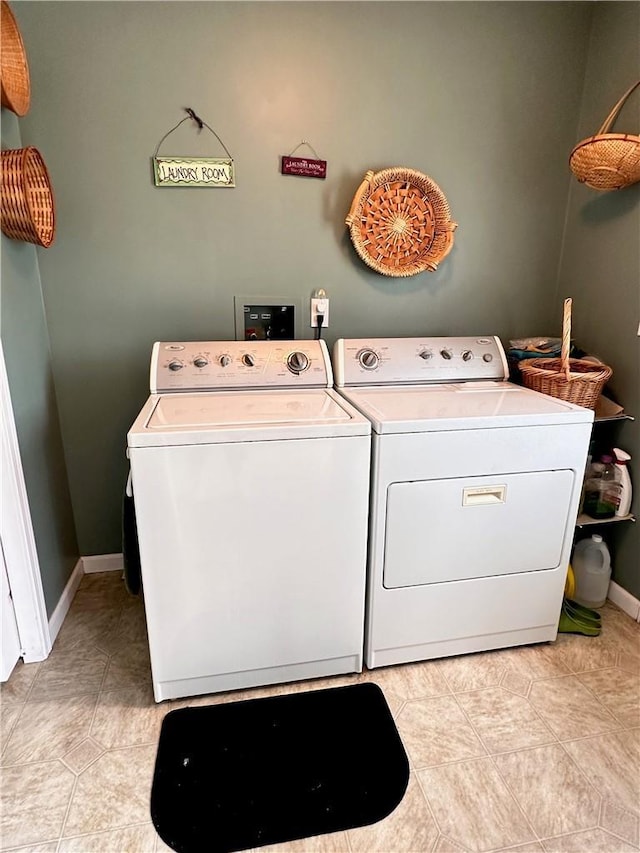 washroom featuring washer and clothes dryer