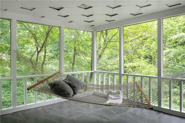 unfurnished sunroom featuring a healthy amount of sunlight