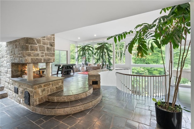 bar featuring a stone fireplace