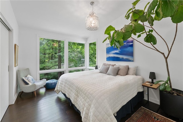 bedroom with dark wood-type flooring