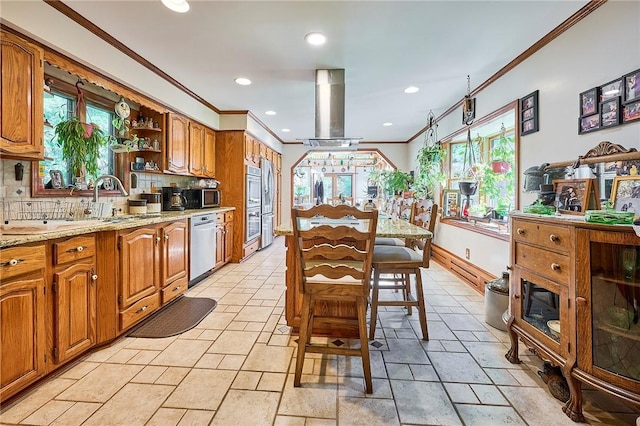 kitchen featuring decorative backsplash, crown molding, a healthy amount of sunlight, and ventilation hood