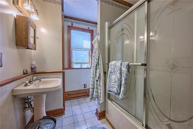 bathroom featuring tile patterned floors, enclosed tub / shower combo, and ornamental molding